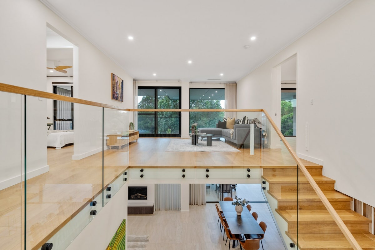 Double-height living area with timber staircase, Floreat